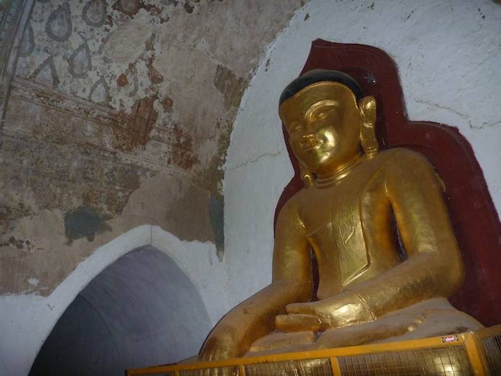 The reconstructed Buddha and behind some original frescos on the ceiling